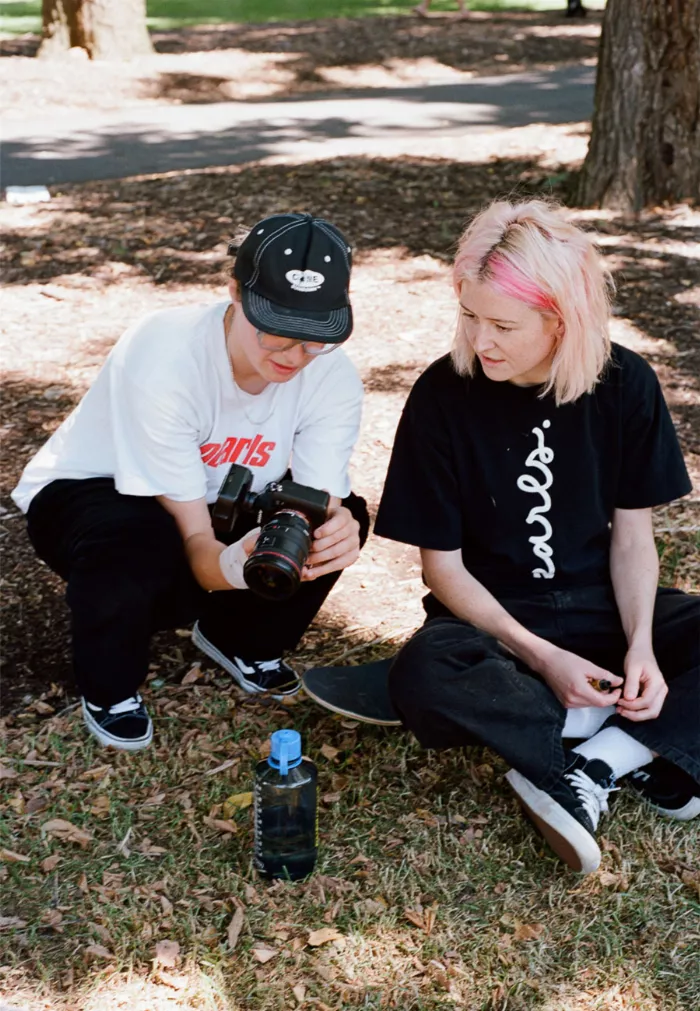 Tobi Stanley standing with Adelaide Norris, both wearing Pearls Skateboards shirts.