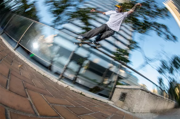 Tyler Bledsoe performing a backside smith grind on a skateboard