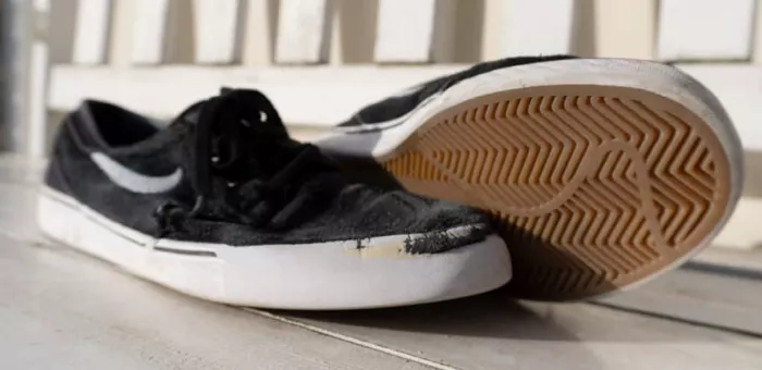 Used Nike skateboarding shoes showing wear and tear