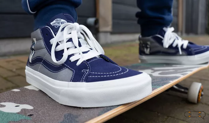 Vans kids skate shoes on a skateboard