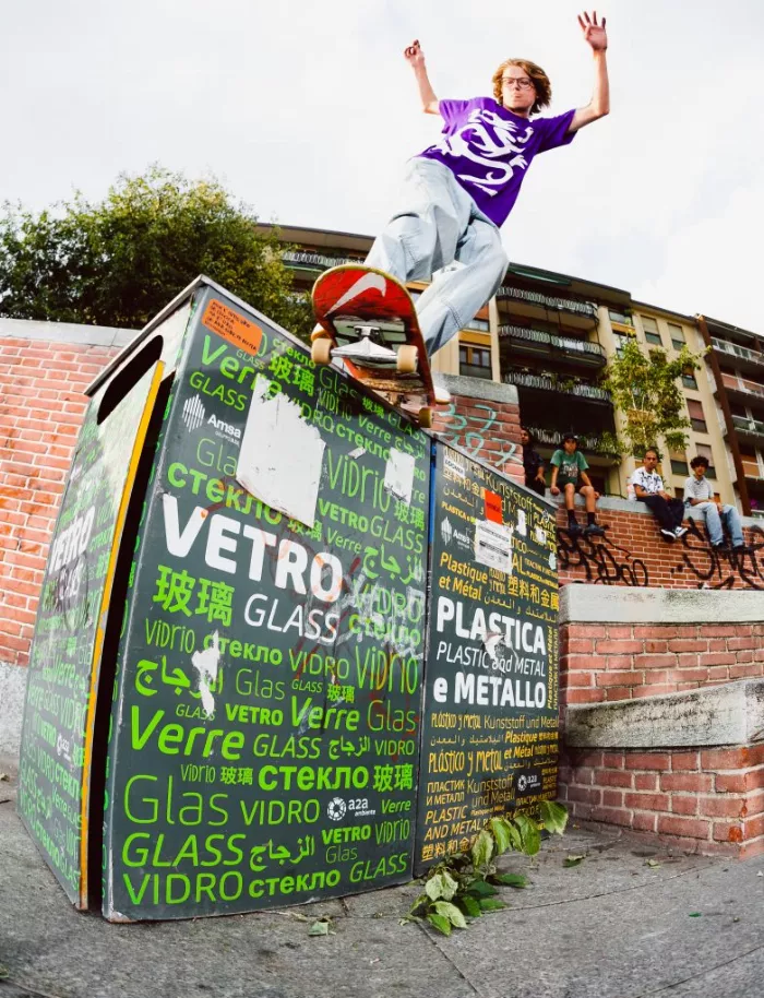 Vince Palmer performing a backside smith grind in Milan