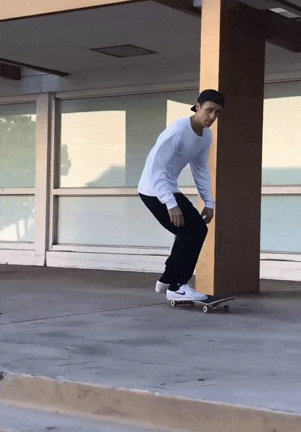 Walker Ryan performs a skateboard trick, demonstrating his skills.