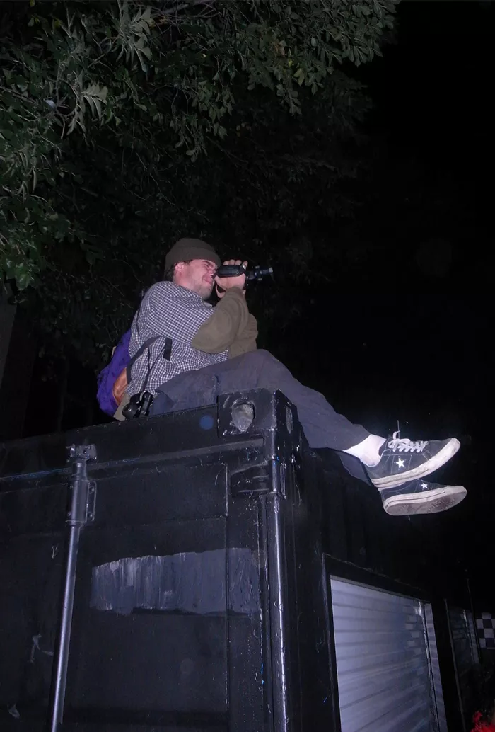 Wilson Lucas getting a good view of the block party from a shipping container